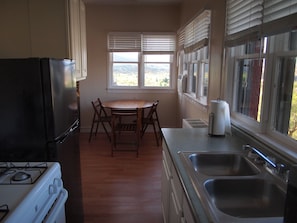 Kitchen and dining area in #208. Just bring food and you are ready to go. 