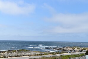 Ocean view from the upstairs master suite on a sunny day