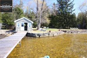 MORE THAN 100 FT OF WATERFRONT AND A HUGE BOATHOUSE