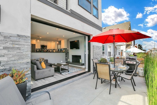 The best part about this home is how the living room opens up to the patio!