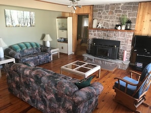 Main gathering area in the large cottage (sorry! the fireplace is currently out of service).