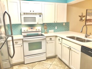 Brand NEW Kitchen w/ Quartz counters, NEW cabinetry, & Glass Backsplash!