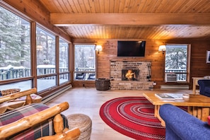 Living area w/ big open windows to enjoy the wildlife