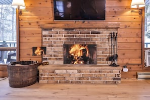 Grab a blanket and enjoy the crackling sounds of the wood burning fireplace