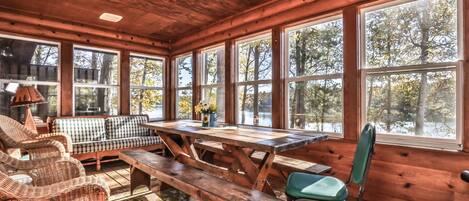 Enclosed porch to enjoy the breathtaking views of the lake