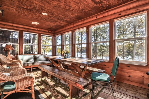 Enclosed porch to enjoy the breathtaking views of the lake