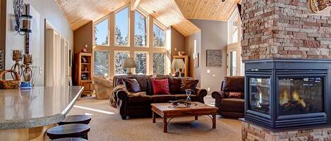 Large living room with warm gas fireplace and plenty of seating