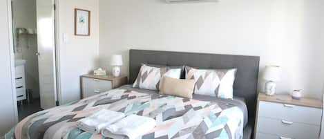 Master bedroom with king bed, ensuite, air con and ceiling fan