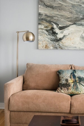 Stylish living area with a second television and pull out couch