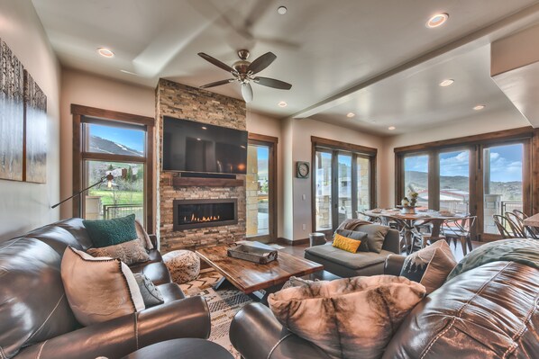 Great Room with Living Room, Dining Area and Kitchen with Beautiful Hardwood Floors Throughout