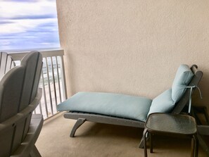 Very comfy chaise to lay back and listen to the waves roll in.