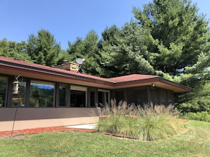 Set in the tall pines, facing south towards the golf course