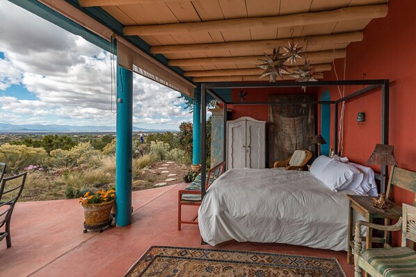 Queen bed in outdoor portal