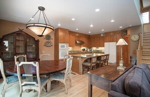 Dining or game table for six, plus three bar seats