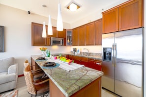 Fully equipped kitchen with dishwasher and countertop with two bar stools!