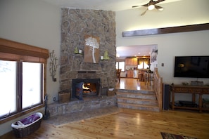 Living Room/Fireplace looking into Kitchen/Dining Room