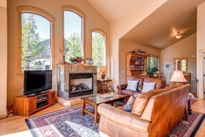 Fireplace, picture windows in Living Area