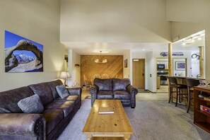Relax with leather furniture and vaulted ceilings