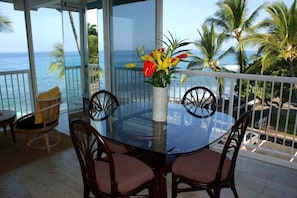 Dining area featuring ocean, park and mountain views.