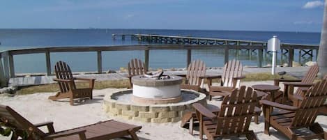 Beachside firepit and fishing pier on site