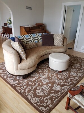 The big comfy couch faces the fireplace and television.