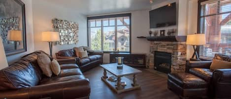 Living Room - 2 sofas (one is a Queen Sleeper Sofa), Chair with Ottoman, Love Seat, Flat screen TV