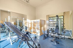 Full indoor gym w/ free weight rack, leg machine, elliptical, bikes, & sauna
