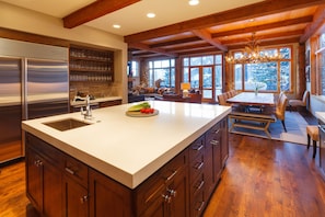 The large kitchen is loaded with top appliances for elegant cooking and catering