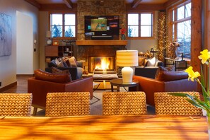 The dining/ living area has plenty of windows for  mountain views and light