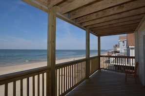 Covered balcony right on the beach (2nd floor)