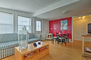 Hardwood floors and several windows highlight the interior.