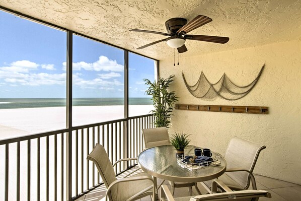 This 2-bedroom, 2-bathroom retreat is set along a private beach.