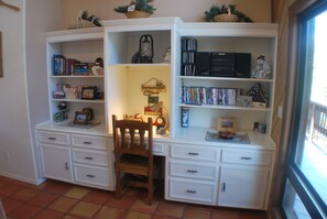 work desk (for those that can't get away) and board-game storage area.