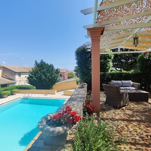 private terrace with swimming pool view 