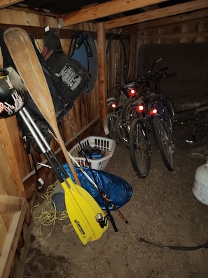 outdoor activities shed with bikes, canoe equipment, fishing gear, etc.