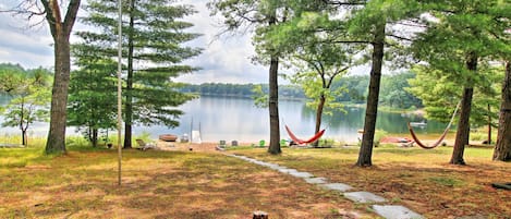 Lake-living awaits at this 2-bedroom, 1-bathroom Baldwin vacation rental cabin.