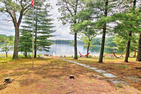 Lake-living awaits at this 2-bedroom, 1-bathroom Baldwin vacation rental cabin.