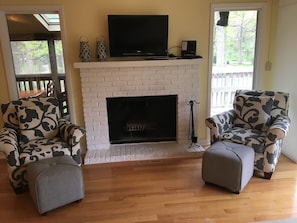 Beautiful family room with working fireplace overlooking upper decks!