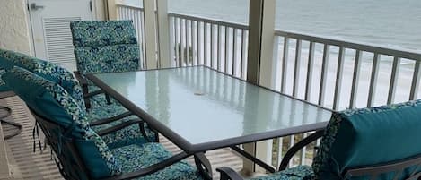 Large scenic balcony with dining table, 6 swivel chairs & stocked beach closet