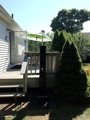 back deck with table/umbrella/chairs
