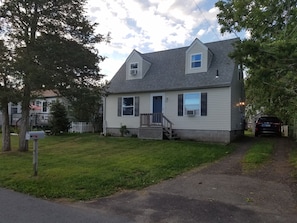 Front of house with driveway for 3 cars