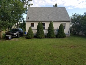 Back of house with large deck/ BBQ grill