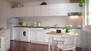 Kitchen area ready for your cooking skills and clothes washer
