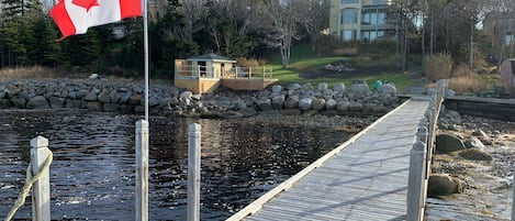 A new deck 12’x16’ and a fire pit completed on 2020 taken of our wharf.