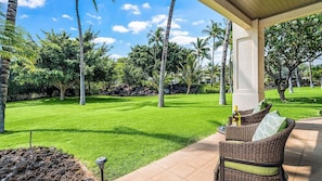 Lanai with serene views & comfortable seating