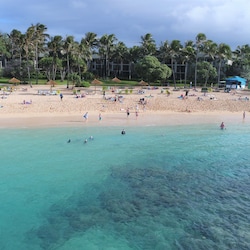 Aerial view of the beach and ocean in front of the Villas - a great place for building sand castles, boogie boarding, and snorkeling at the Turtle Bay Resort!