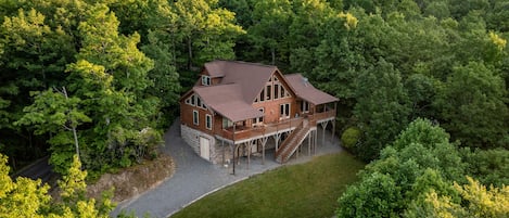 View of back of cabin with mountain views