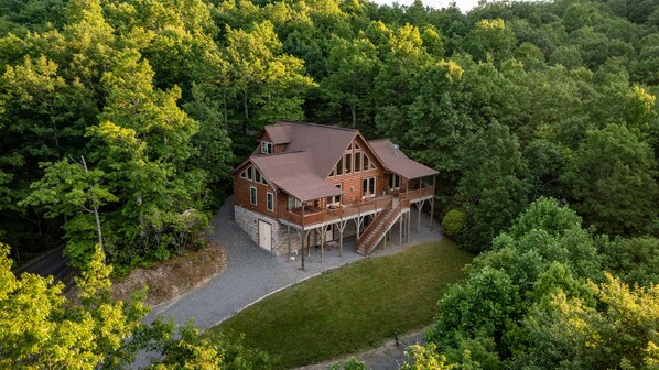 View of back of cabin with mountain views