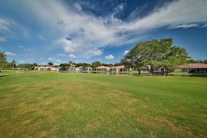 SW4-105 - The screened in lanai offers a gorgeous garden and golf course view