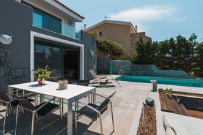 Swimming Pool and Sitting facilities next to the pool - Dining table 